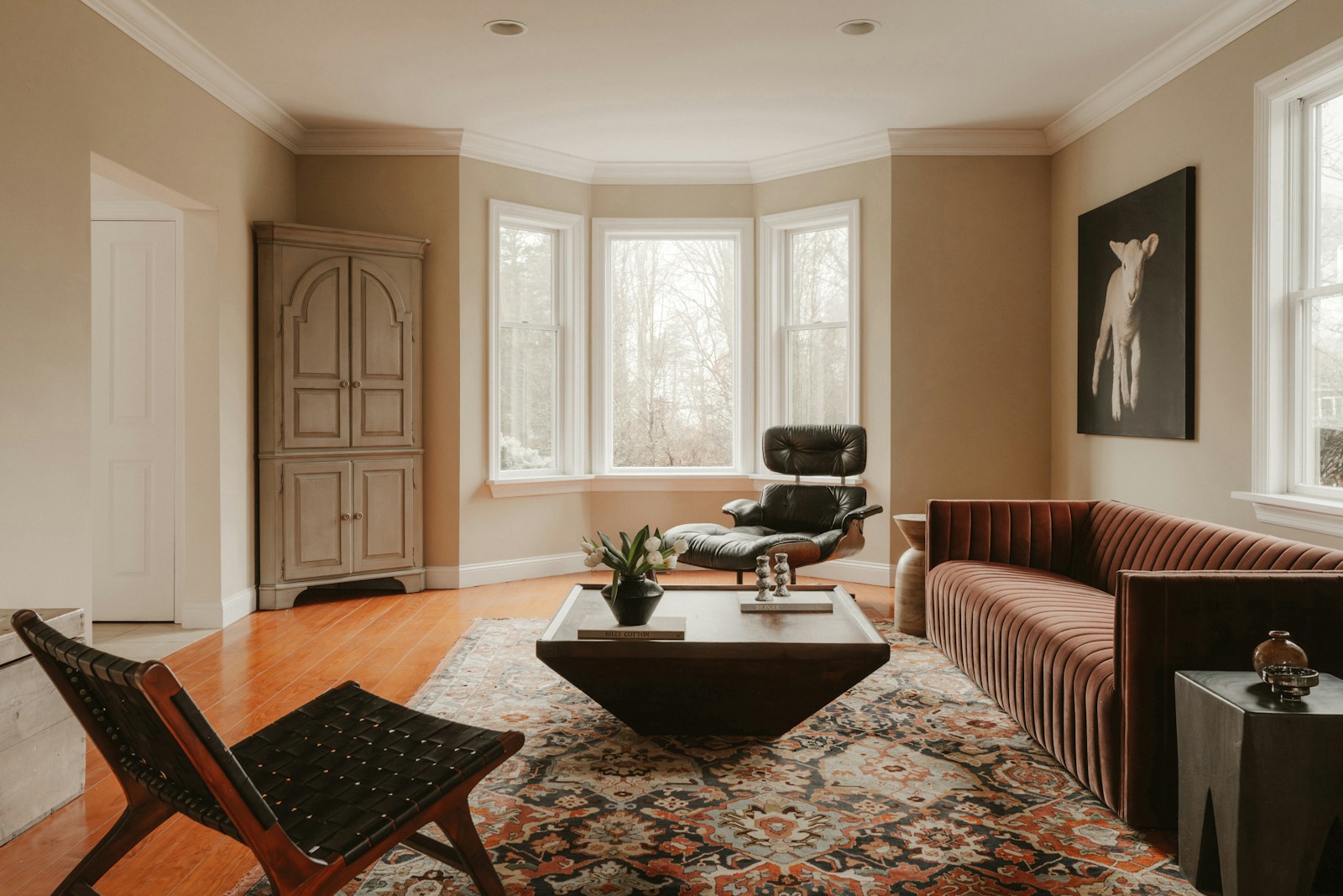 Warm, established living room with comfortable seating and timber floors